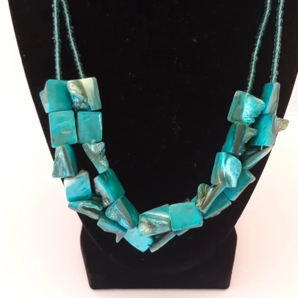 2 strand shell like turquoise necklace.